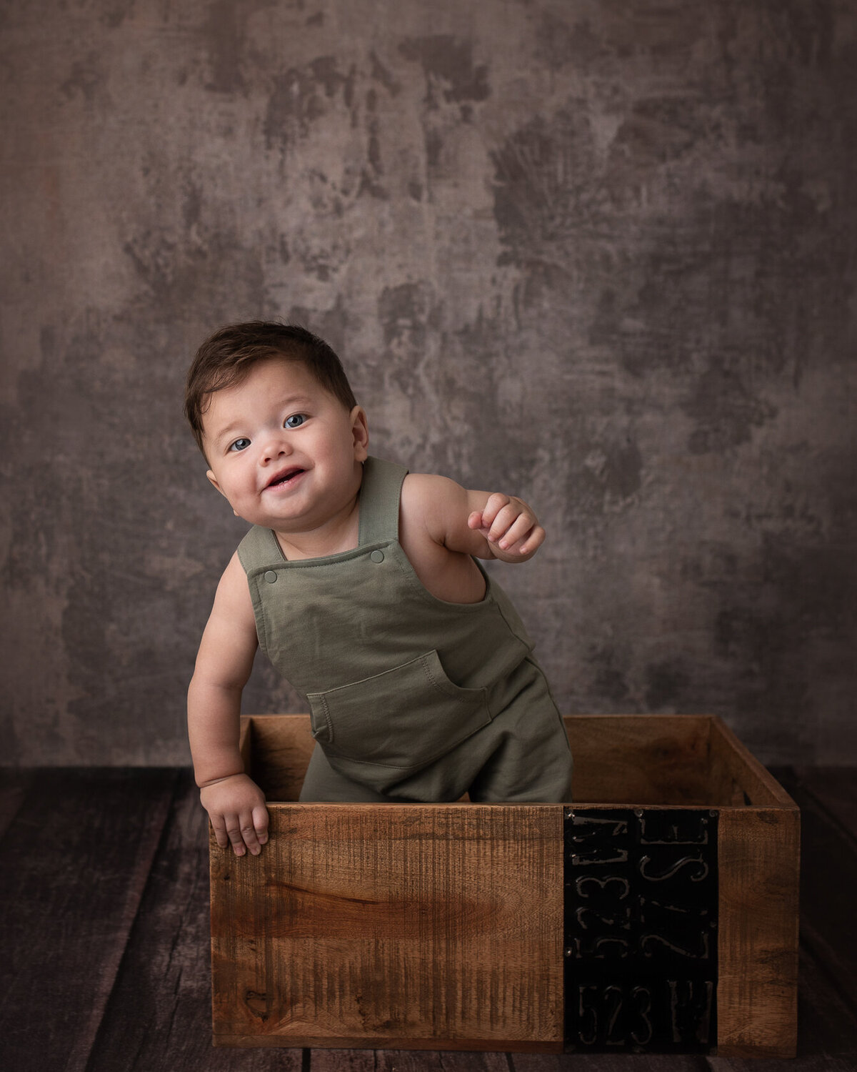 Standing baby in a creative Bucket captured by Laura King Photography