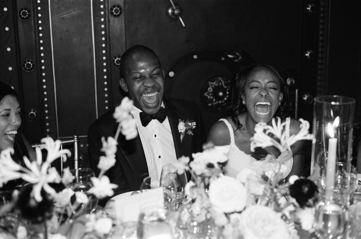 laughing couple at wedding reception weylin