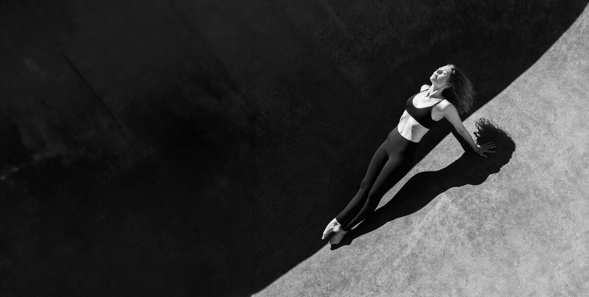 dancer with strong shadow and highlight  in a plank- dance photography madison wi