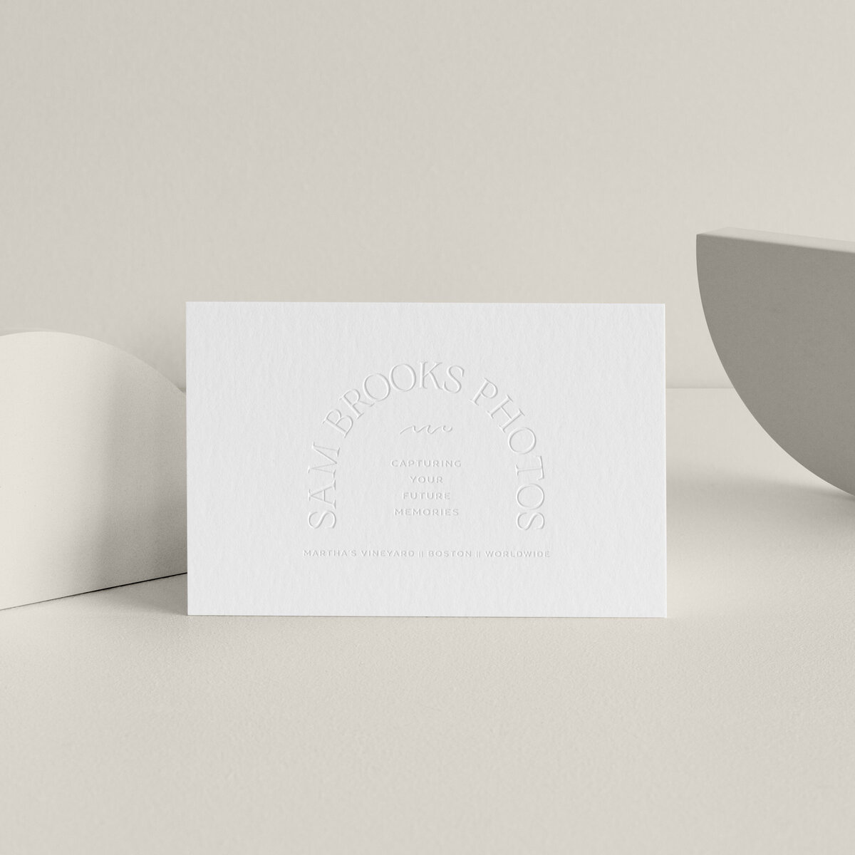 a mockup showing an arch logo design on stationery