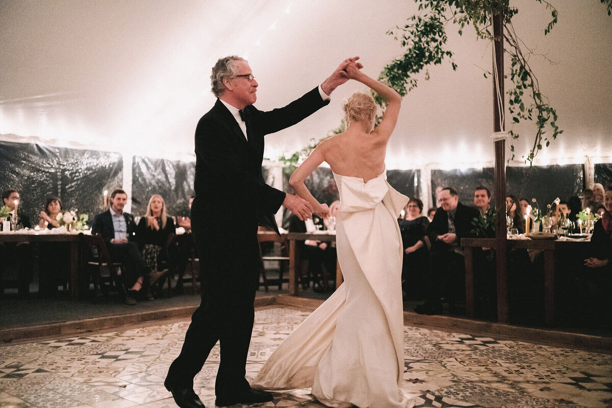 The bride and her father are dancing on the dance floor in Foxfire Mountain House, New York. Wedding Image by Jenny Fu Studio