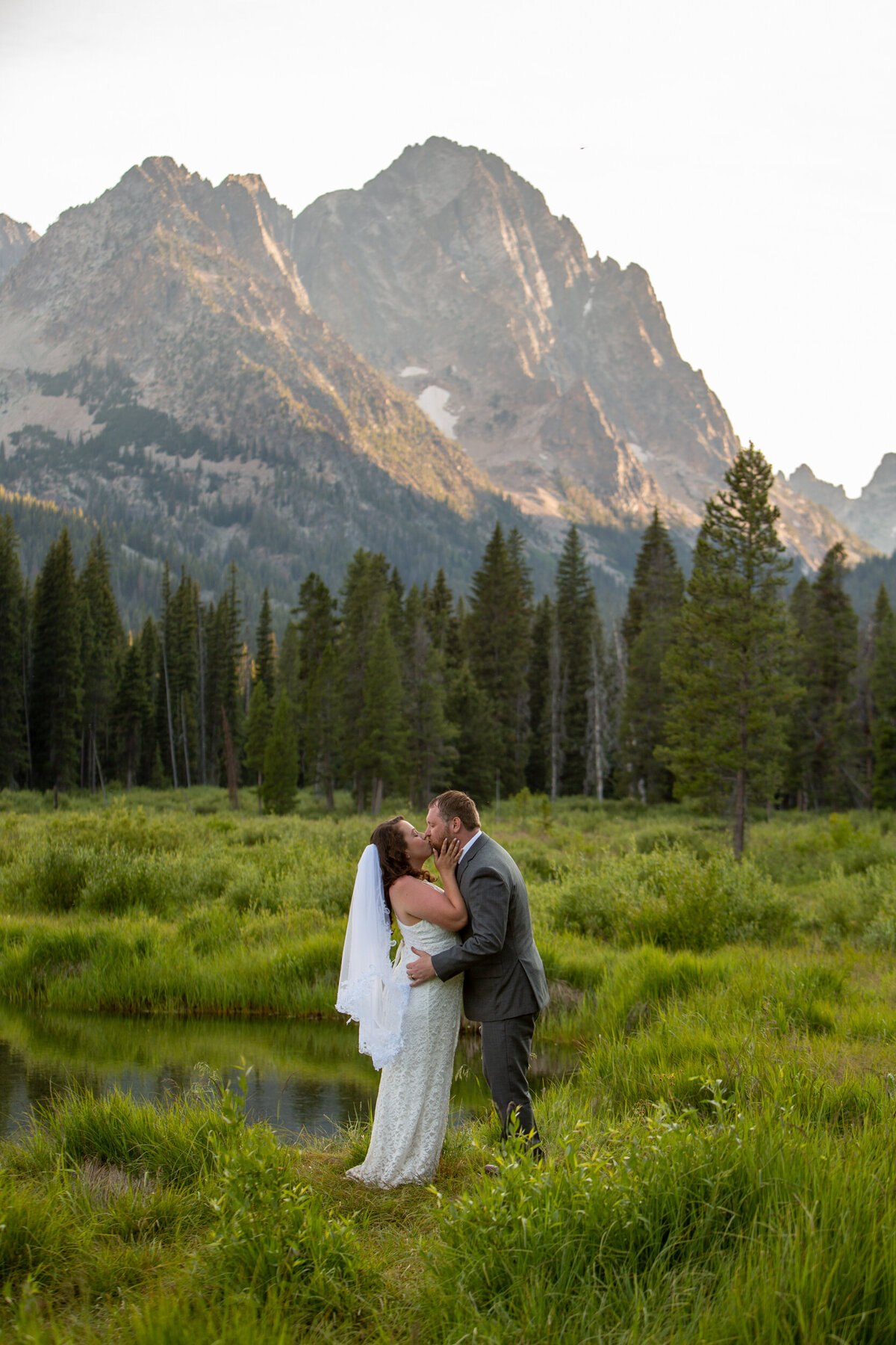 A bride and groom kiss after their Idaho elopement ceremony.
