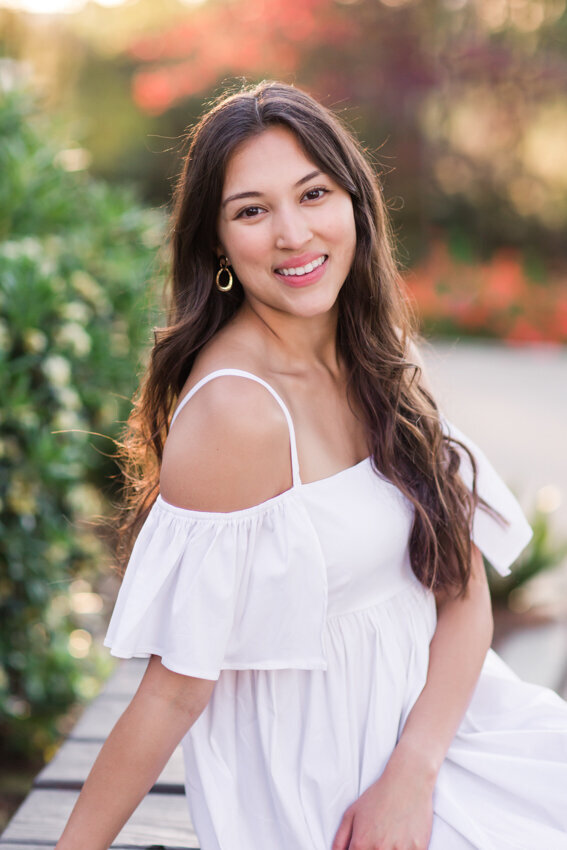 San Diego state senior in white dress