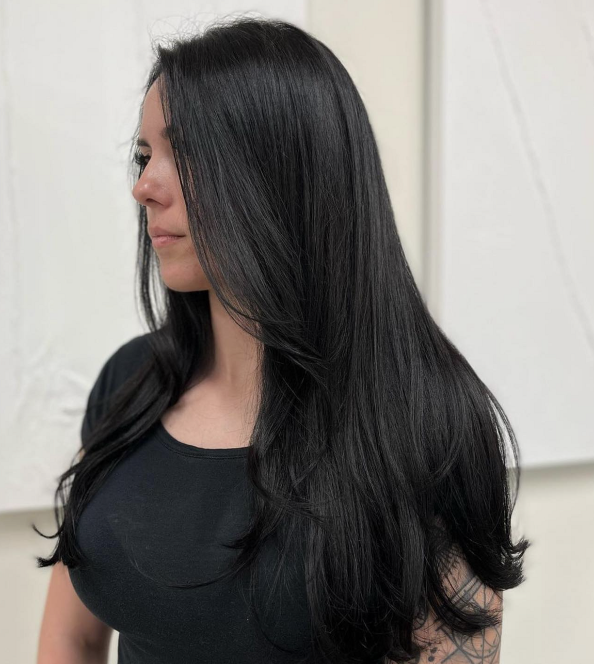 Elevate your look with Nova Strands Salon's straight jet black hair expertise. Experience timeless elegance today.