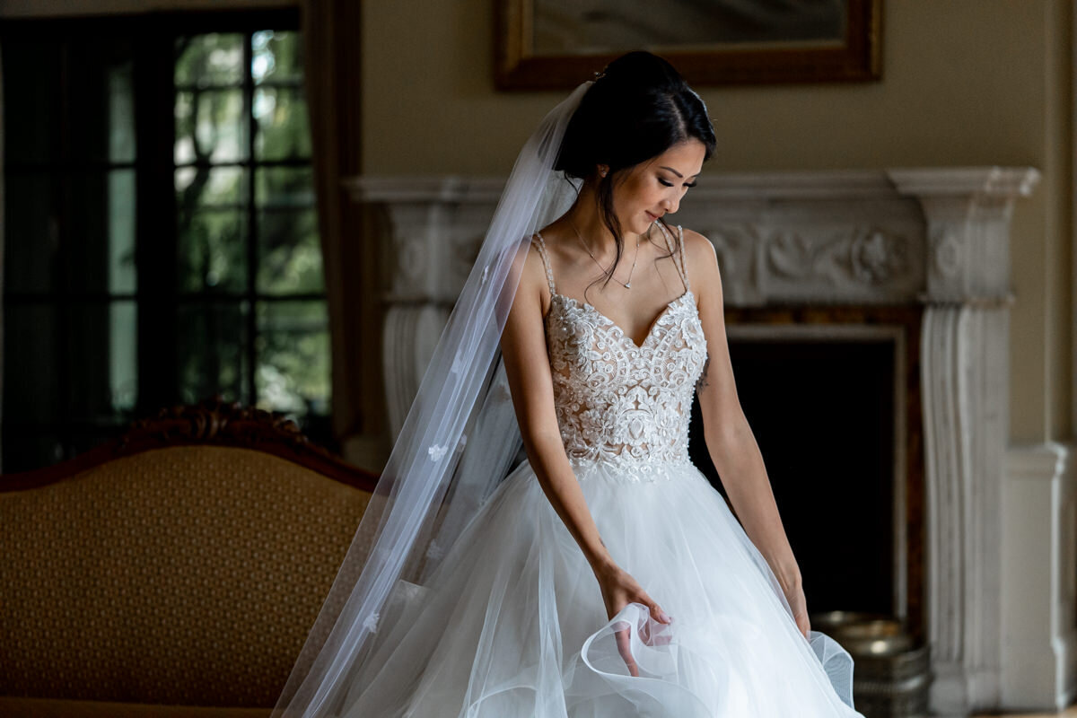 bride sitting by the window at Hycroft Manor