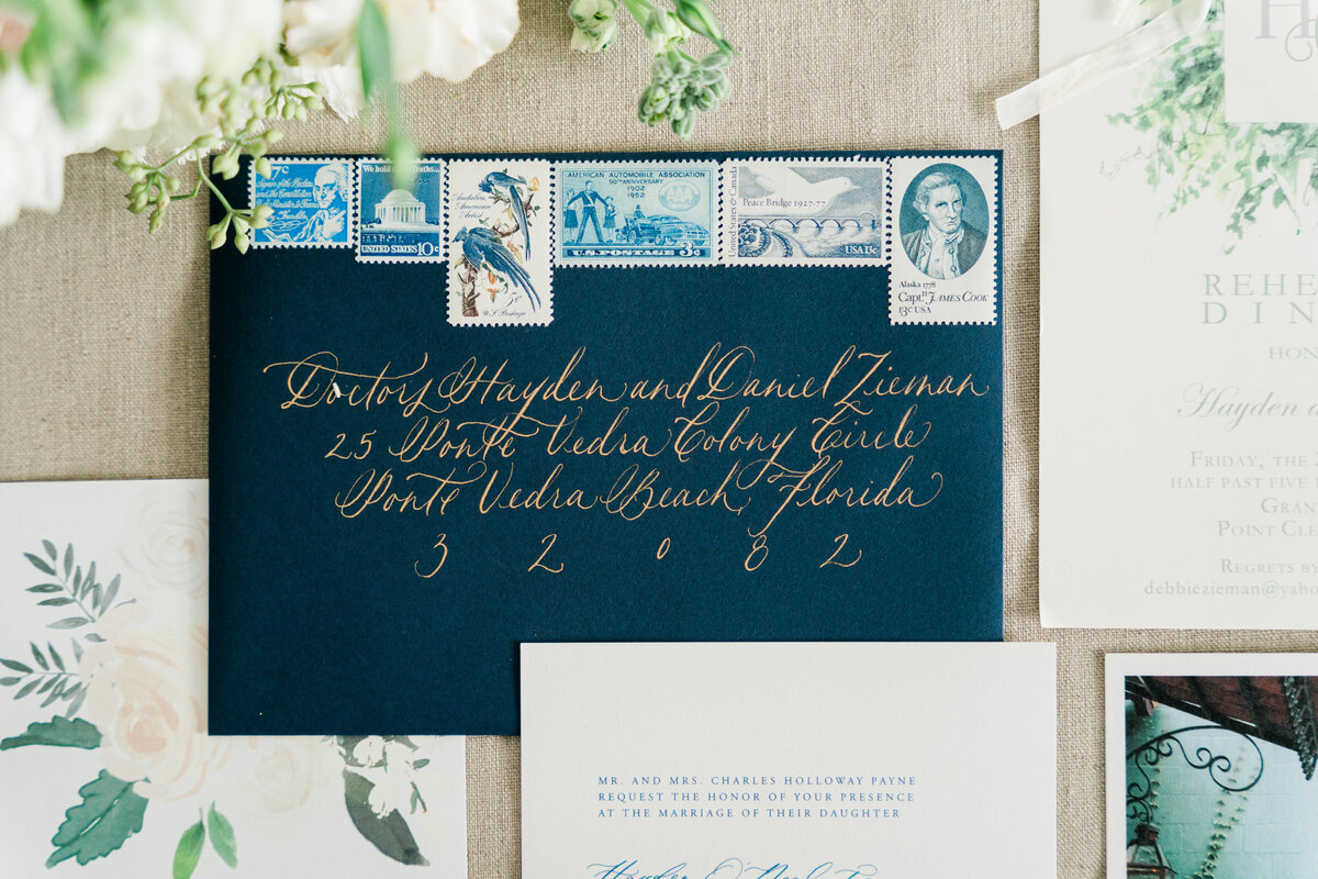Navy blue wedding invitation with gold ink