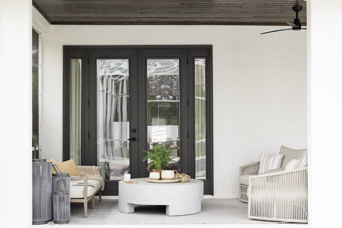 dewine design orlando interior designer belle isle outside patio with black french trimmed doors