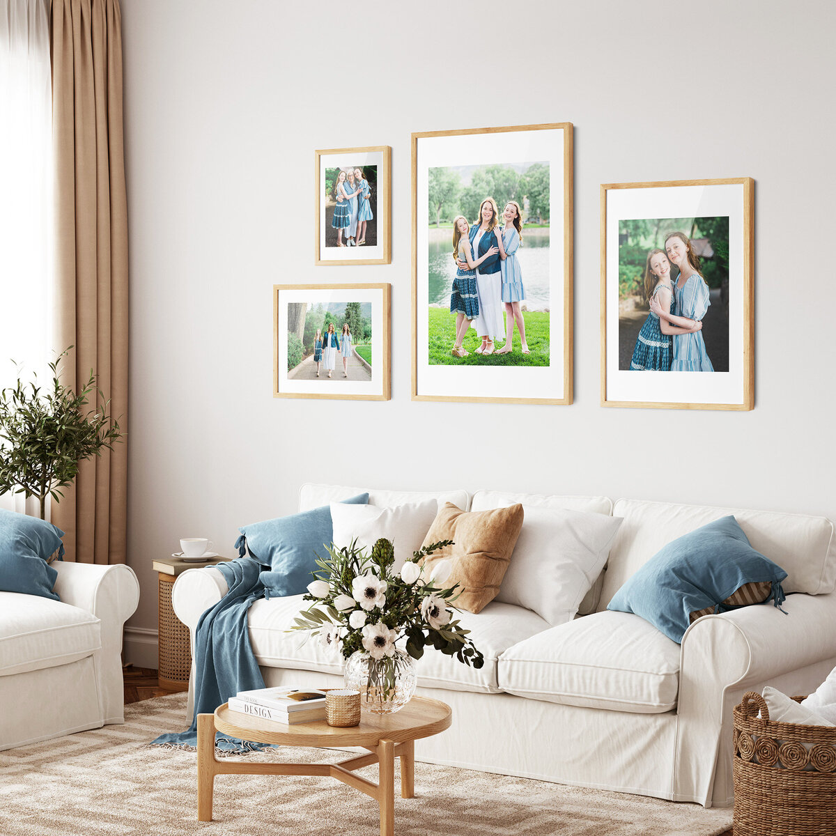 Above a white couch, within a stylish home, 4 family pictures hang on the wall