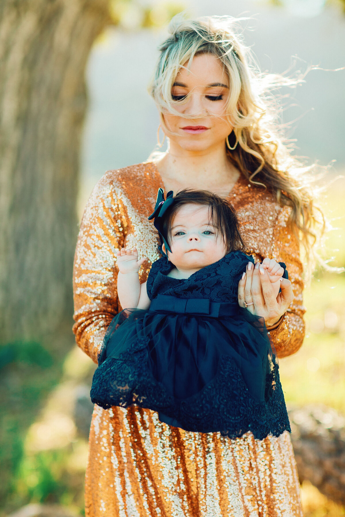Family Portrait Photo Of Mother In Orange Dress Carrying Her Baby In Blue Dress Los Angeles
