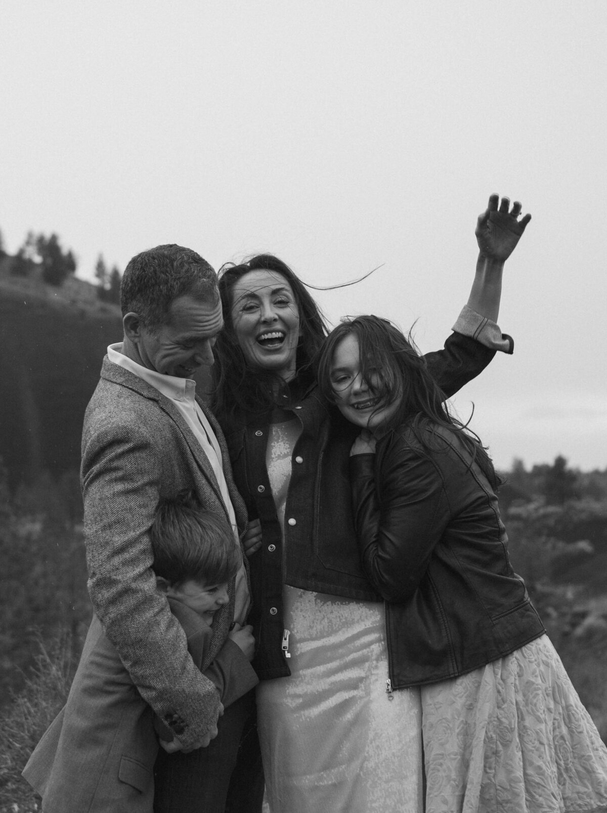 fun-filled candid family portrait in Bend, Oregon, capturing a moment of playfulness and joy