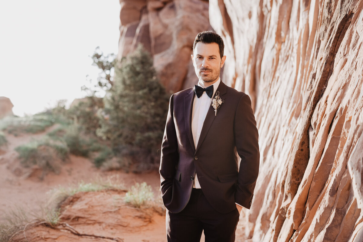 Utah elopement photographer captures groom with hands in pockets