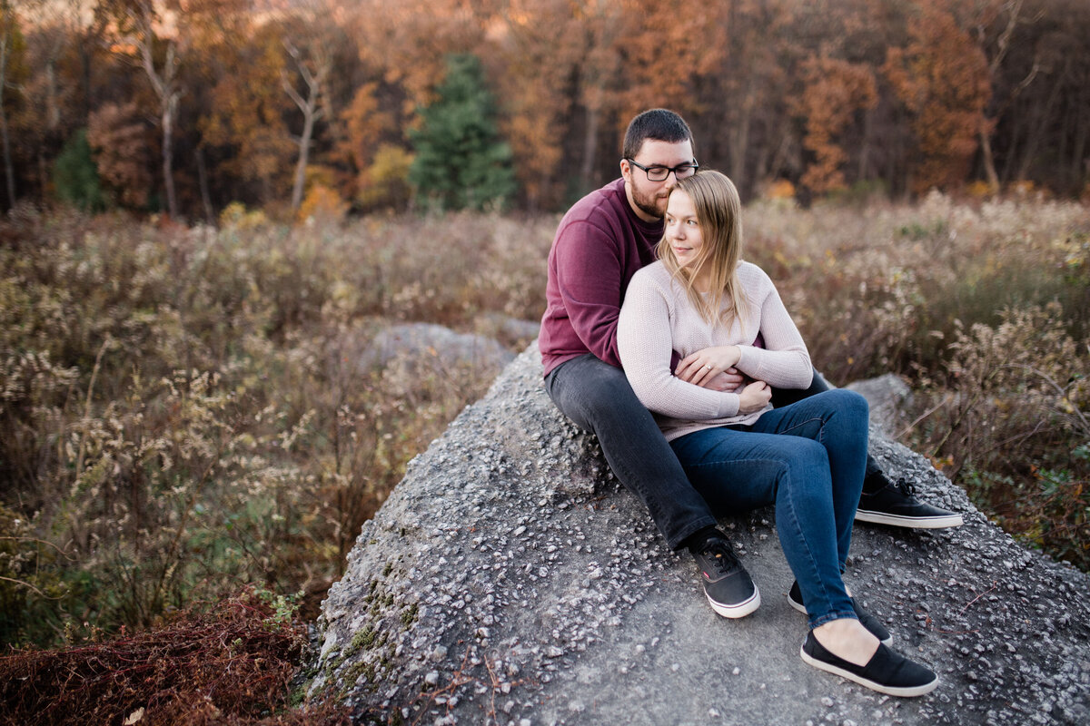 Couple sitting on a rock in Rocky Ridge County Park