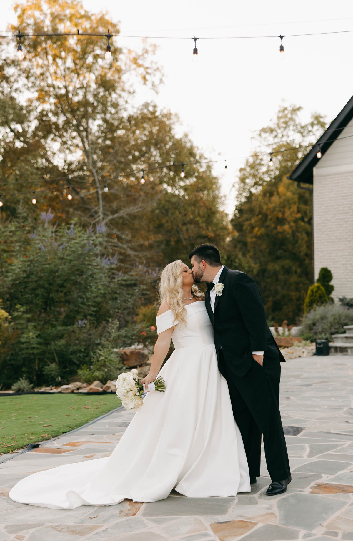 bride and groom subtle dip kiss