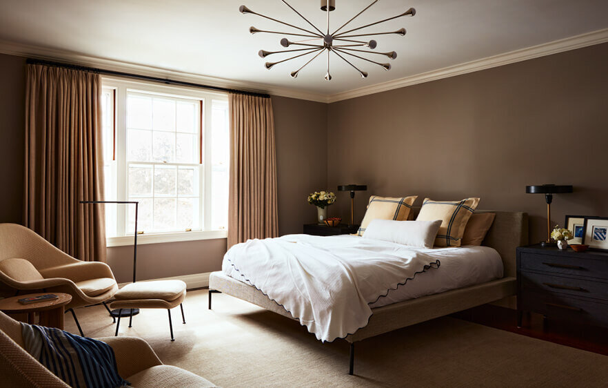 A Boston interior designer creates a refined bedroom interior design in a historic Concord home, blending classic details with a modern aesthetic.