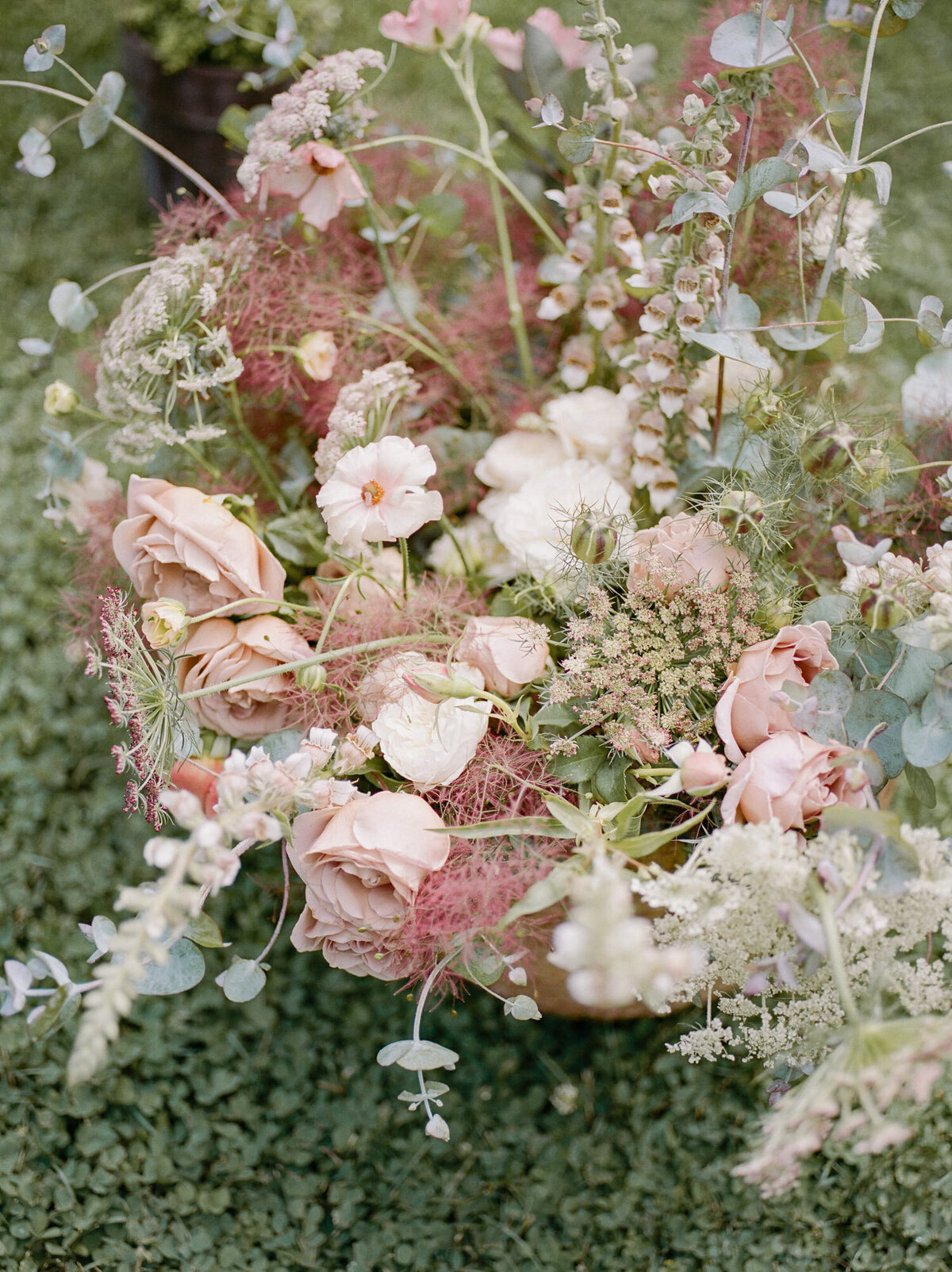abundant, lush pink spring wedding flowers at greenhouse wedding venue in Michigan