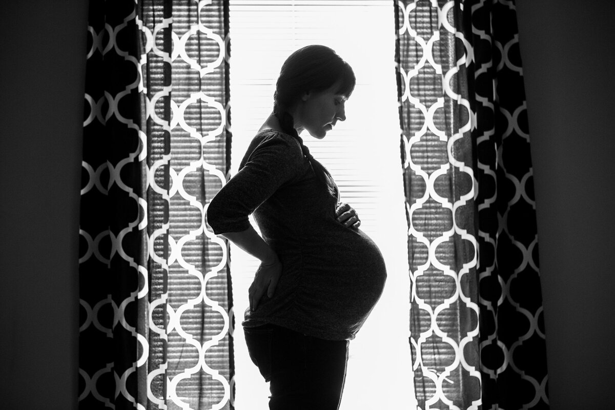 black and white maternity silhouette in home