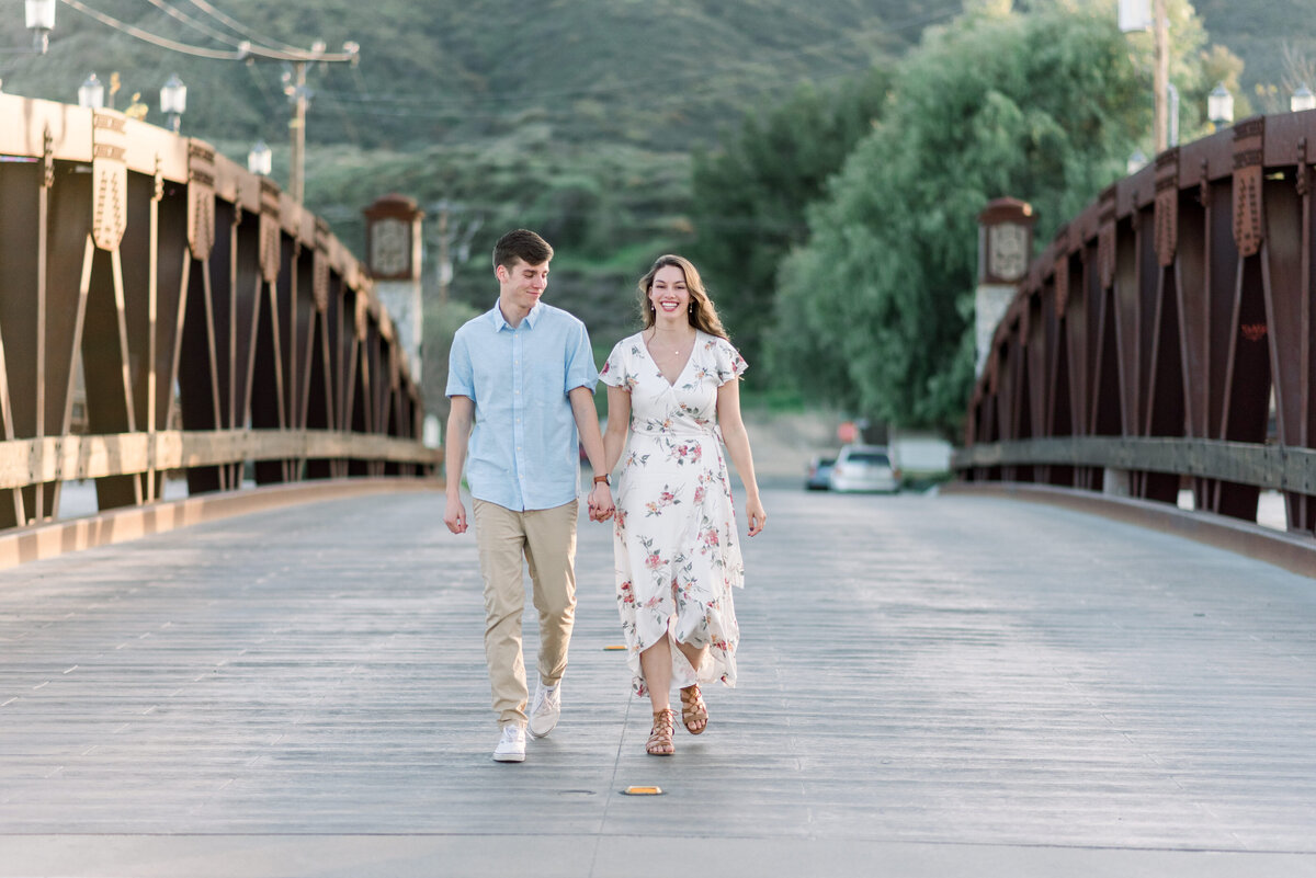 Couple walking at the temecula bridge