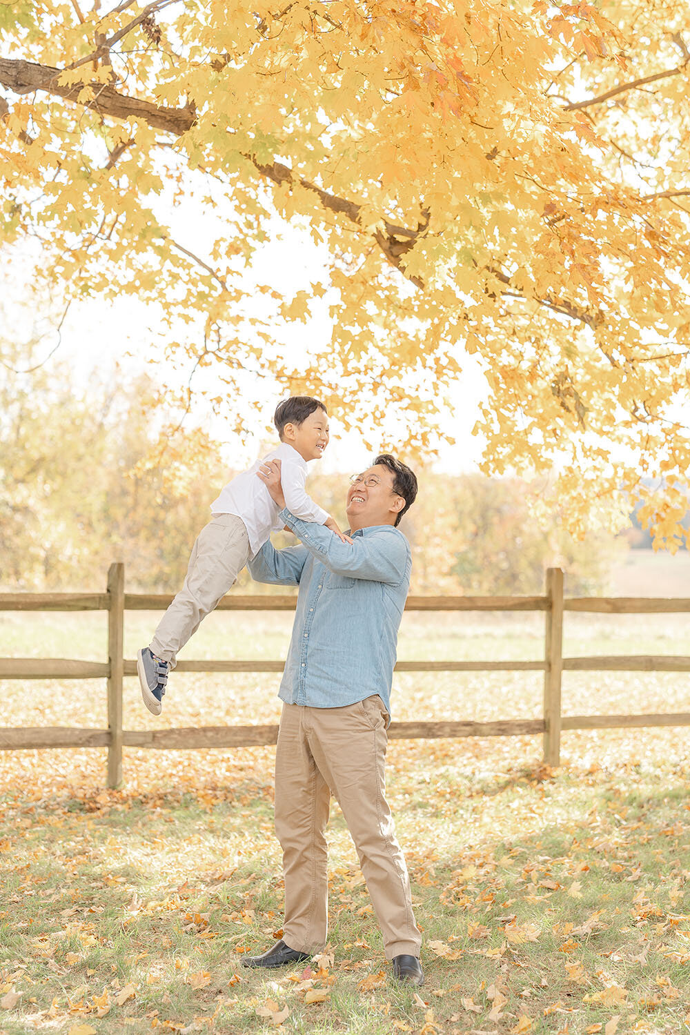 dad and son playing during Northern VA fall minis