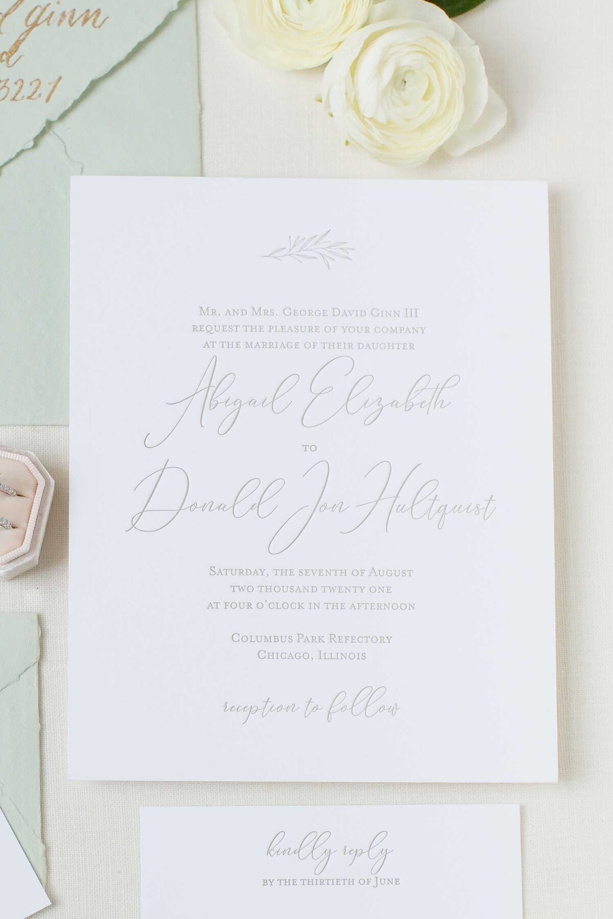 Handmade paper wedding invitation with a pastel envelope at Luxury Chicago Outdoor Historic Wedding Venue