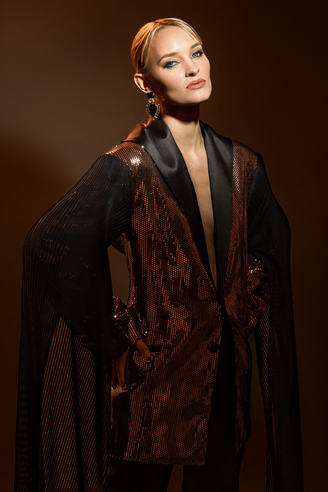 Elegant portrait of Pernilla in a dark textured jacket, exuding sophistication, photographed by Ylva Erevall.