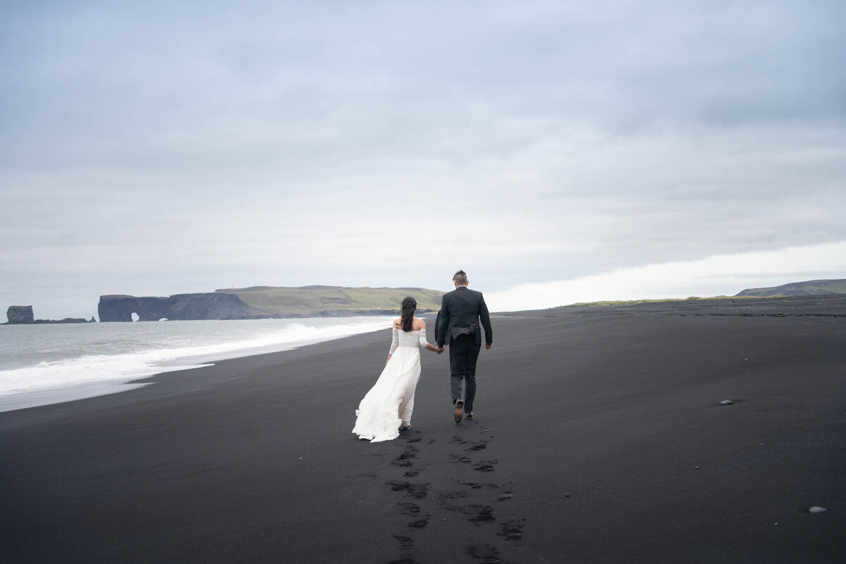 Reynisfjara-Iceland-elopement-foot-prints-black-sand