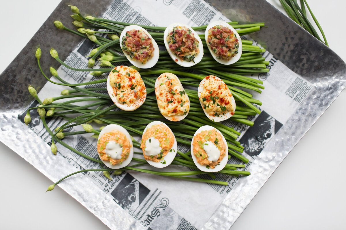 assorted gourmet deviled eggs on a bed of fresh local chives at Willowbrook wedding venue