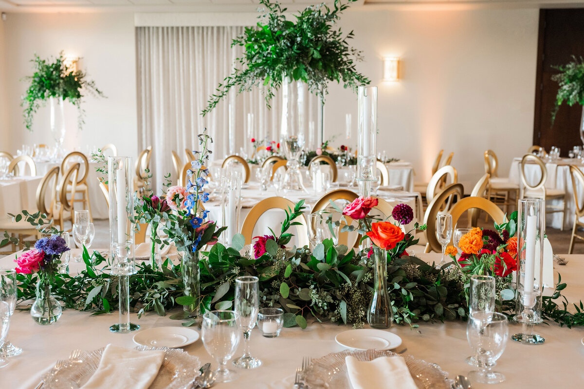 wedding flowers designed by lou lou blooms on display at a reception inside the ballroom at The Lake Club Ohio