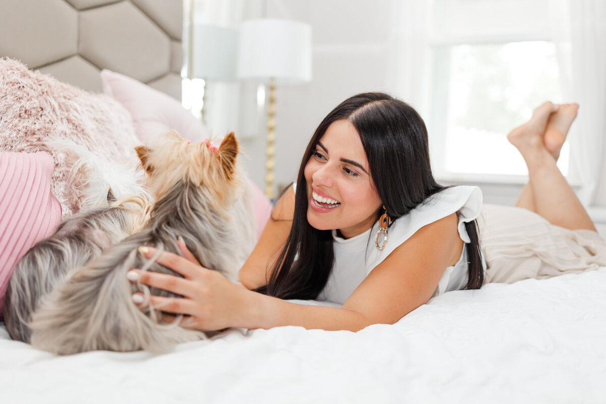 woman-dogs-yorkies-bedroom