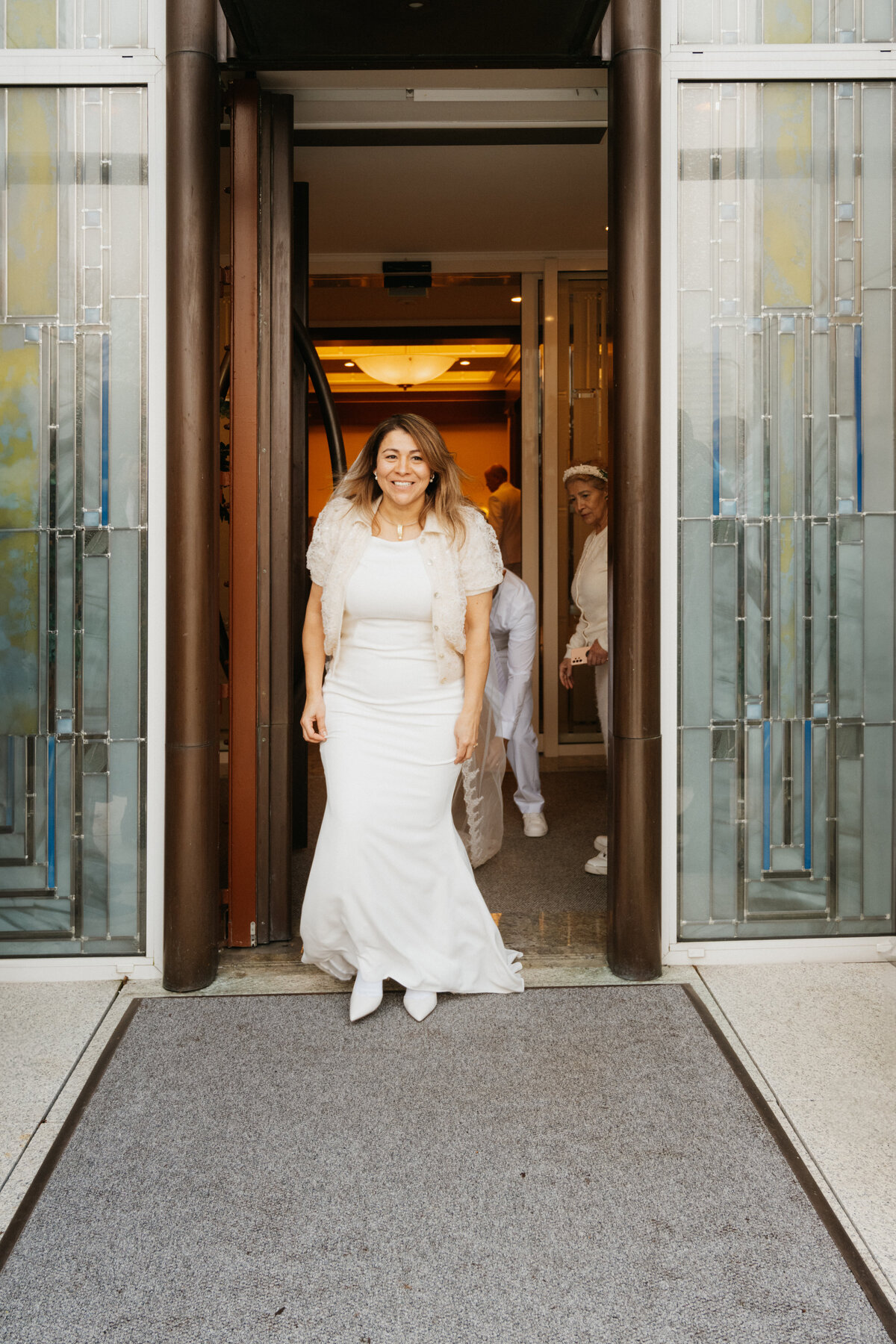 A bride walks out of the temple of the Church of Jesus  Christ of Latter Day Saints in Zoetermeer after their international ceremony
