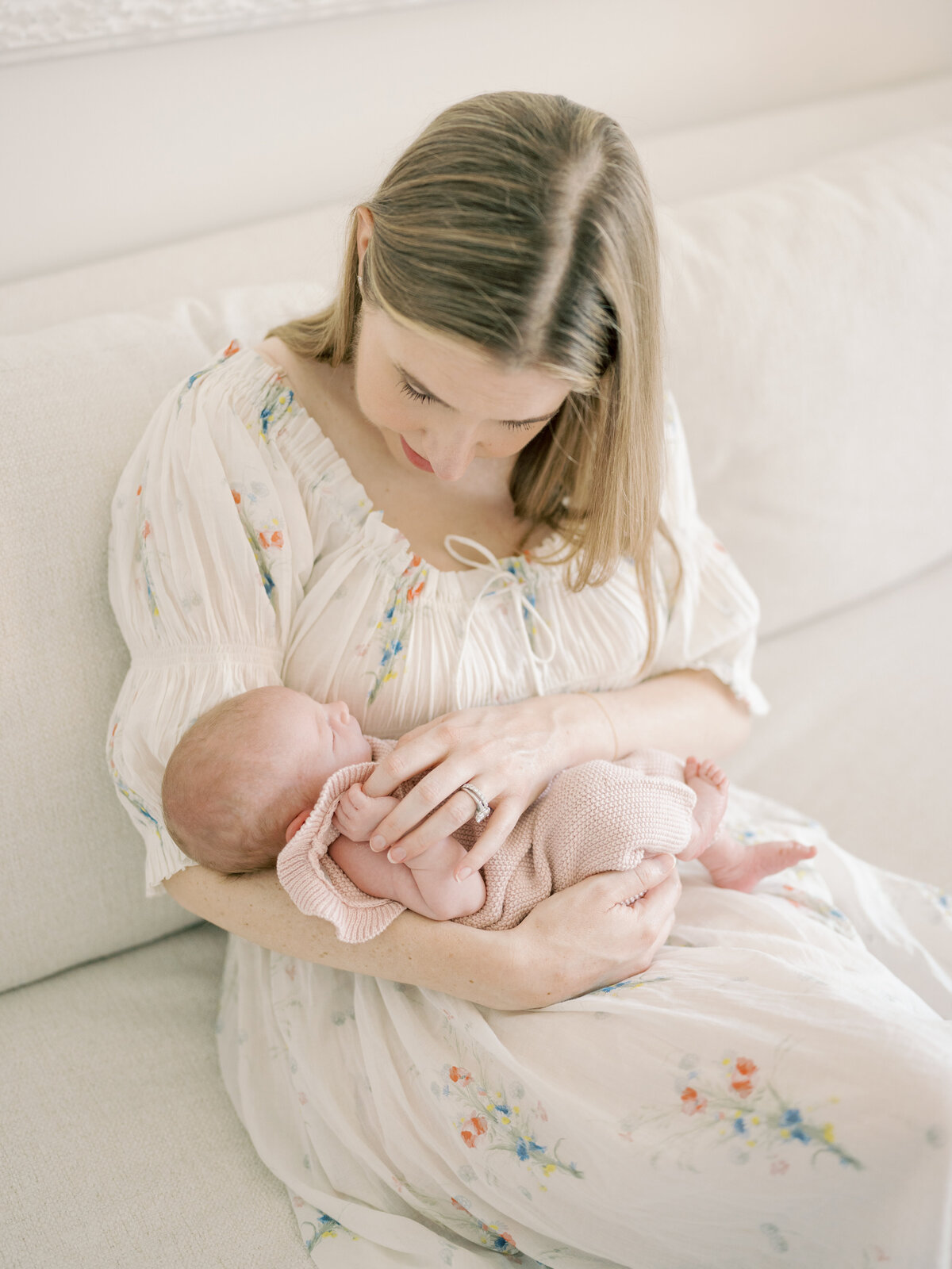 mom holding newborn baby in arms