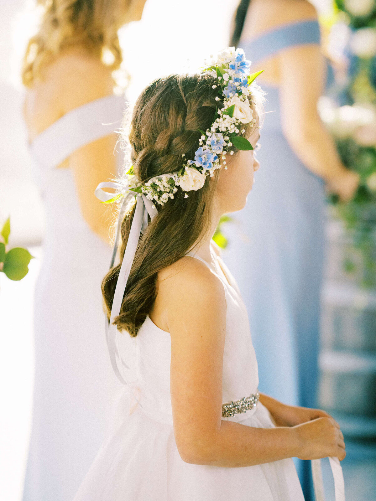 Junior bridesmaid with long hair and flower crown at North Texas wedding at The Vineyard at Florence