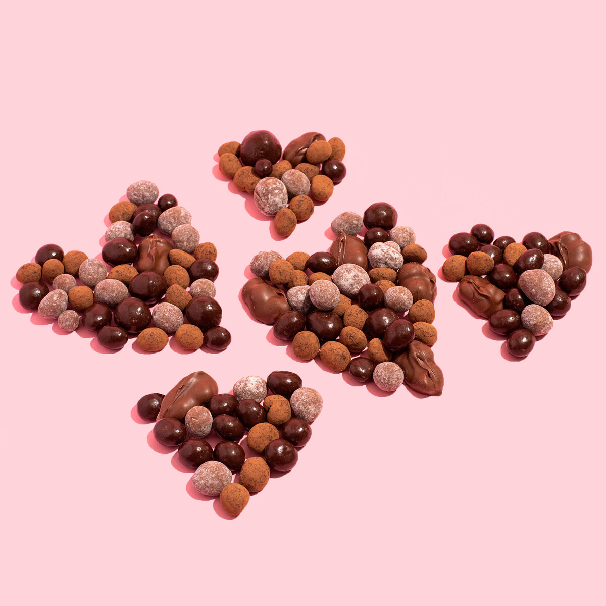 chocolate covered macadamia nuts in the shape of a heart
