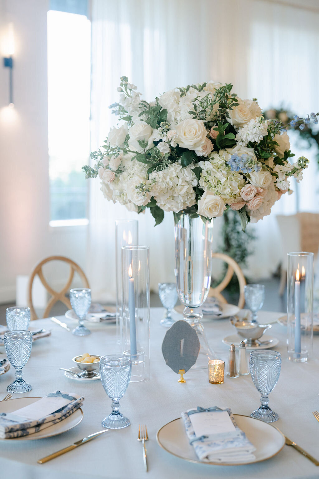 garden arrangement, hourglass, taper candles, candle light , formal, elegant 