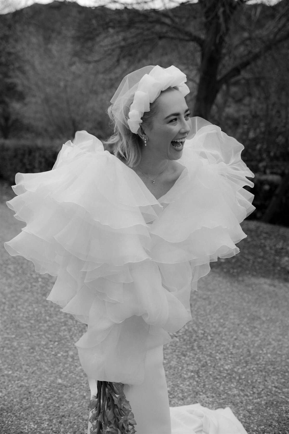 brideinontrendandfashionweddingdressblackandwhitewithhairandmakeup