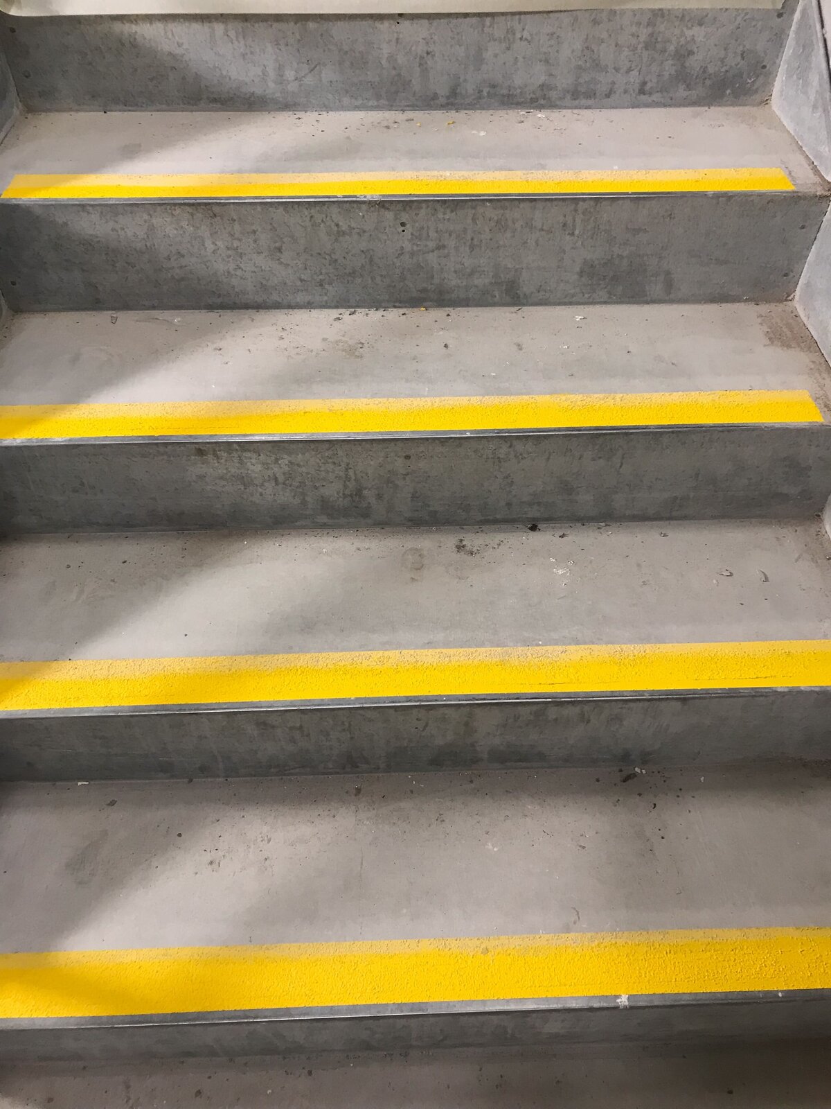 Yellow linemarking stair treads for stairs.