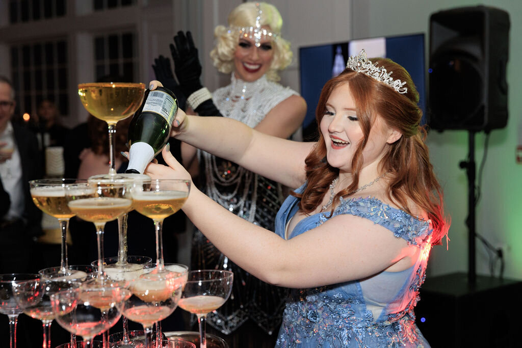 Sweet 16 girl pouring champagne tower
