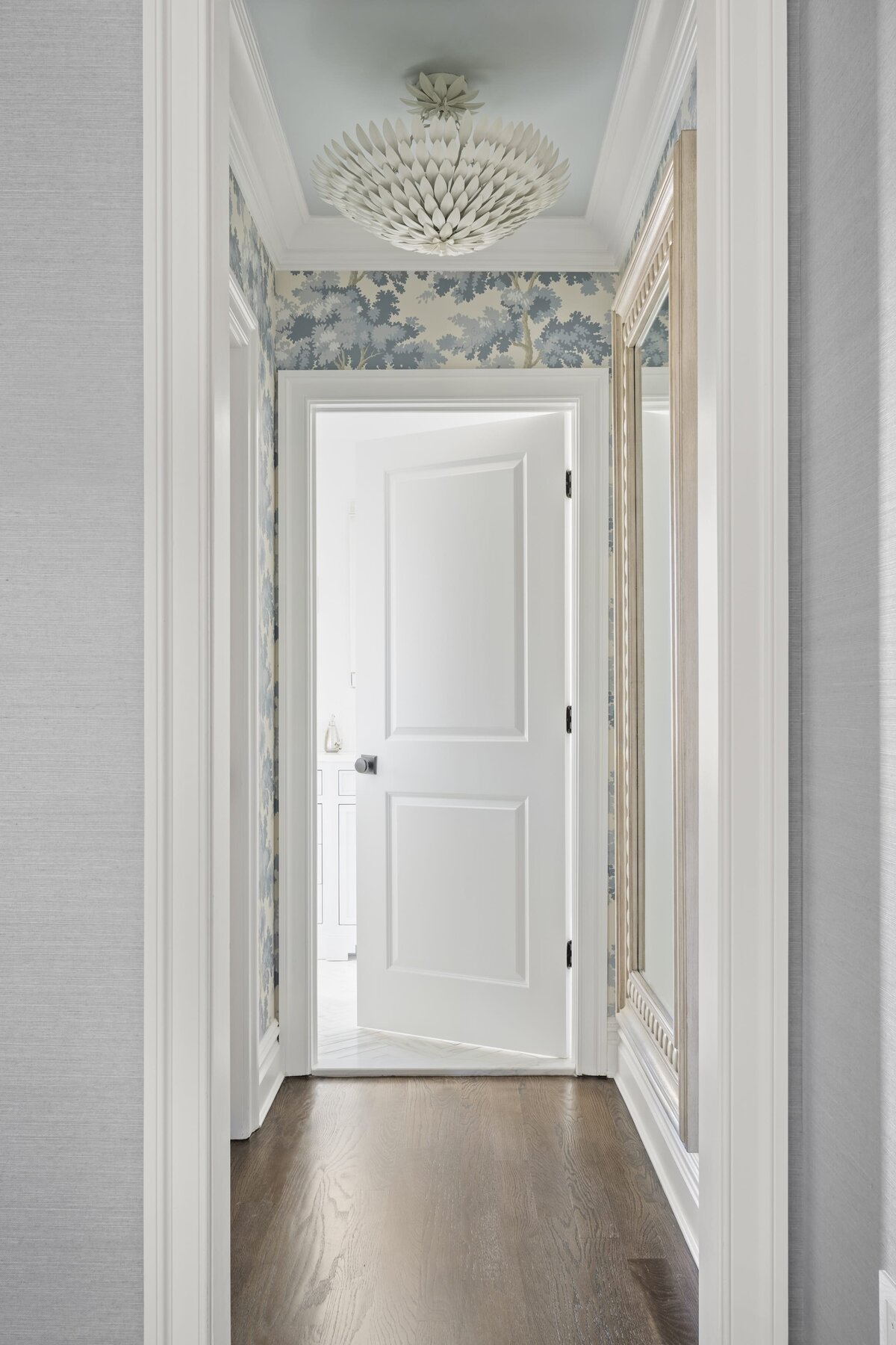 candra lynn interiors ocean port project hallway with wood flooring and decorative wallpaper