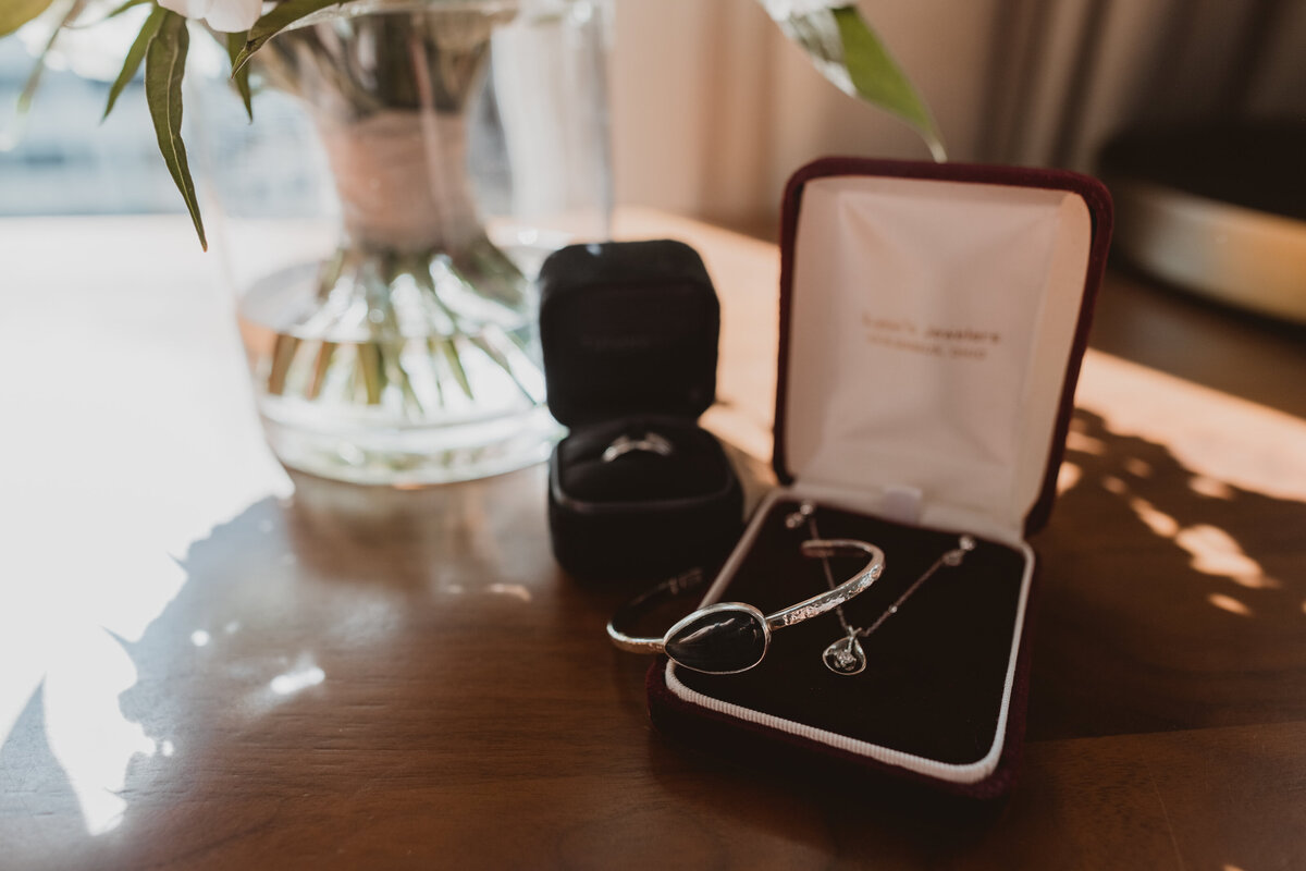 Detail shot of her jewelry on  her wedding day.