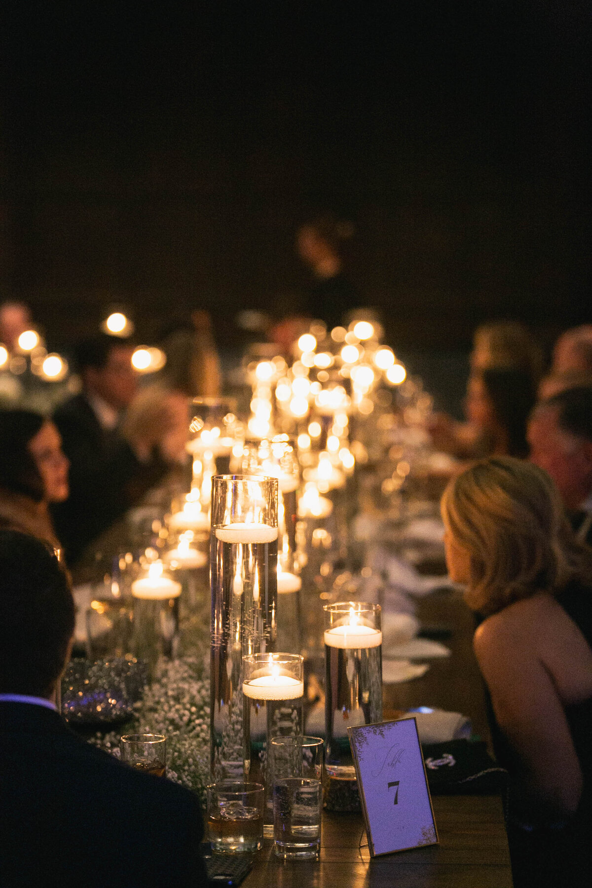 guests sitting at table for wedding dinner
