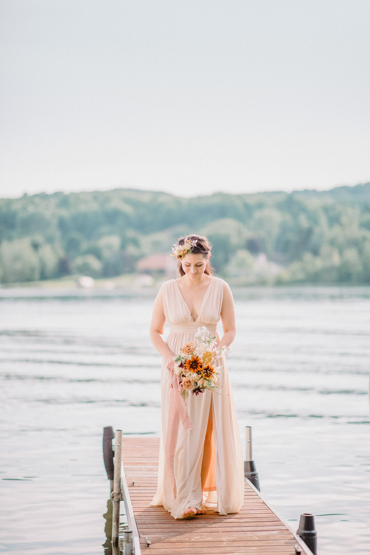 bride standing on pier in Michigan