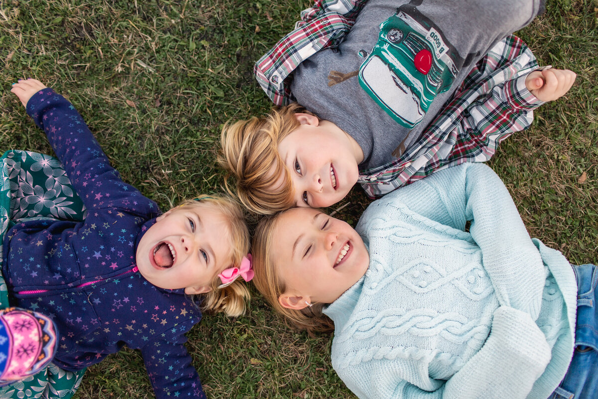 Fun, playful sibling moment during a lifestyle family photoshoot..