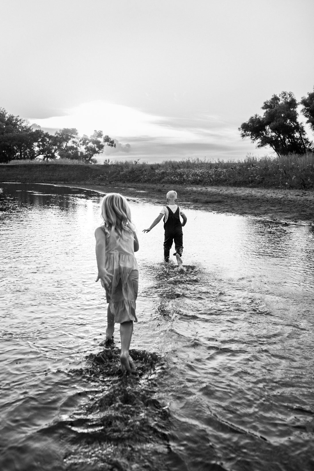 brother-and-sister-running-in-creek