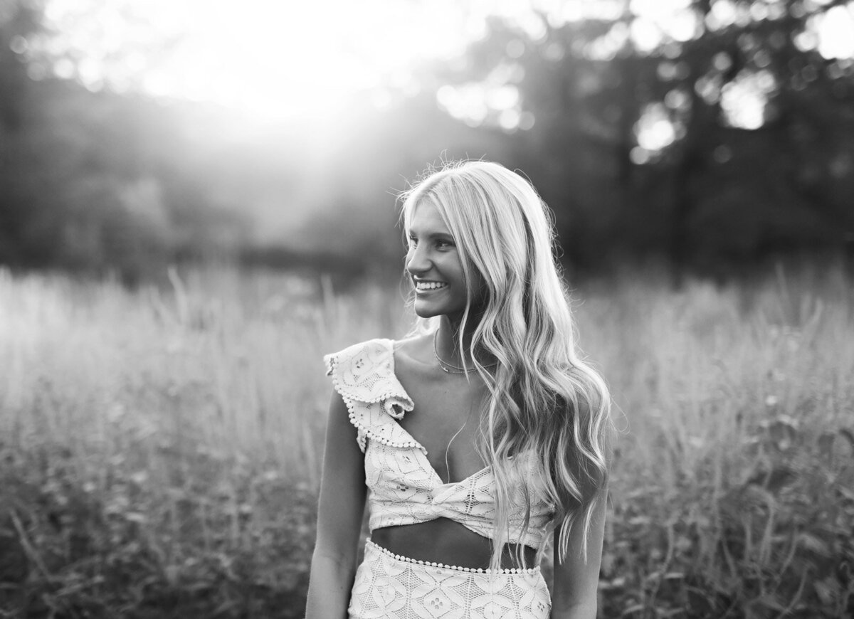 Senior photoshoot in St. Louis – a black and white image of a blonde senior in a lace dress