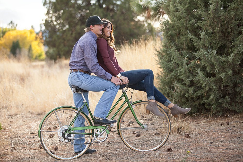 Cute couple on bicycle during Fall engagement session