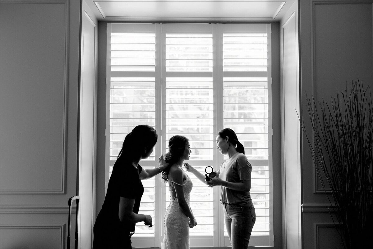 Bride getting ready touch ups makeup artist dramatic Toronto Wedding Venue Jacqueline James Photography