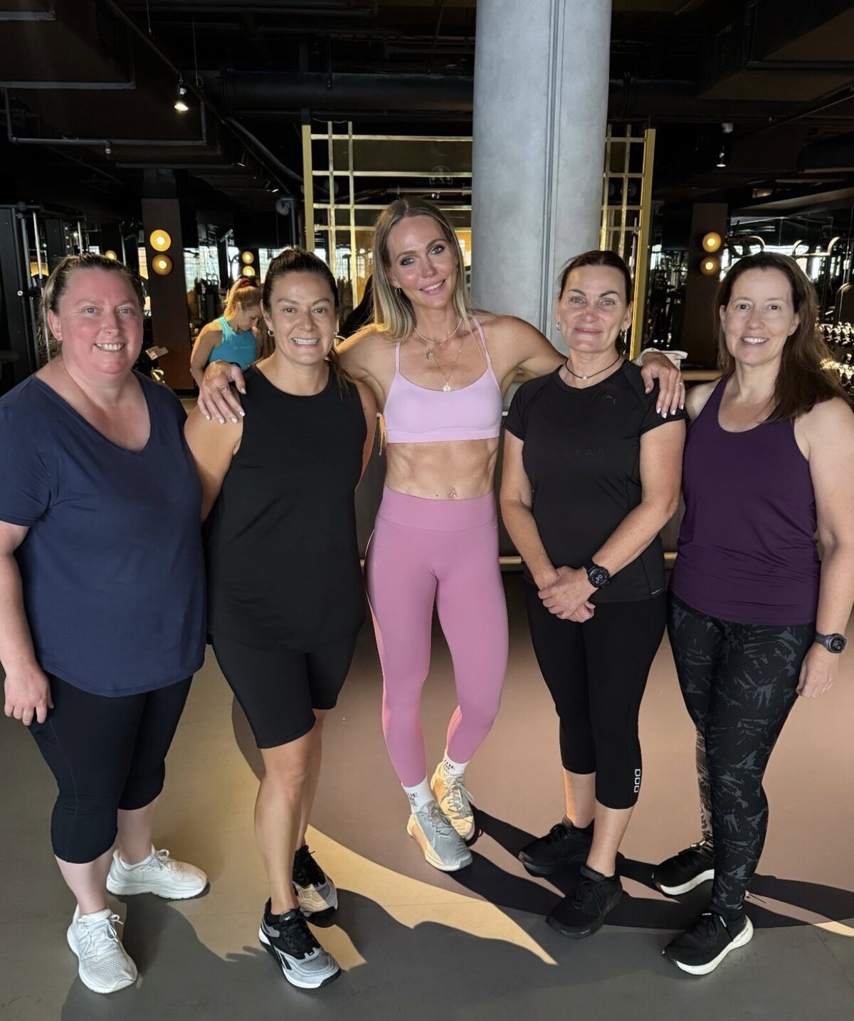 Libby with APM clients at the gym