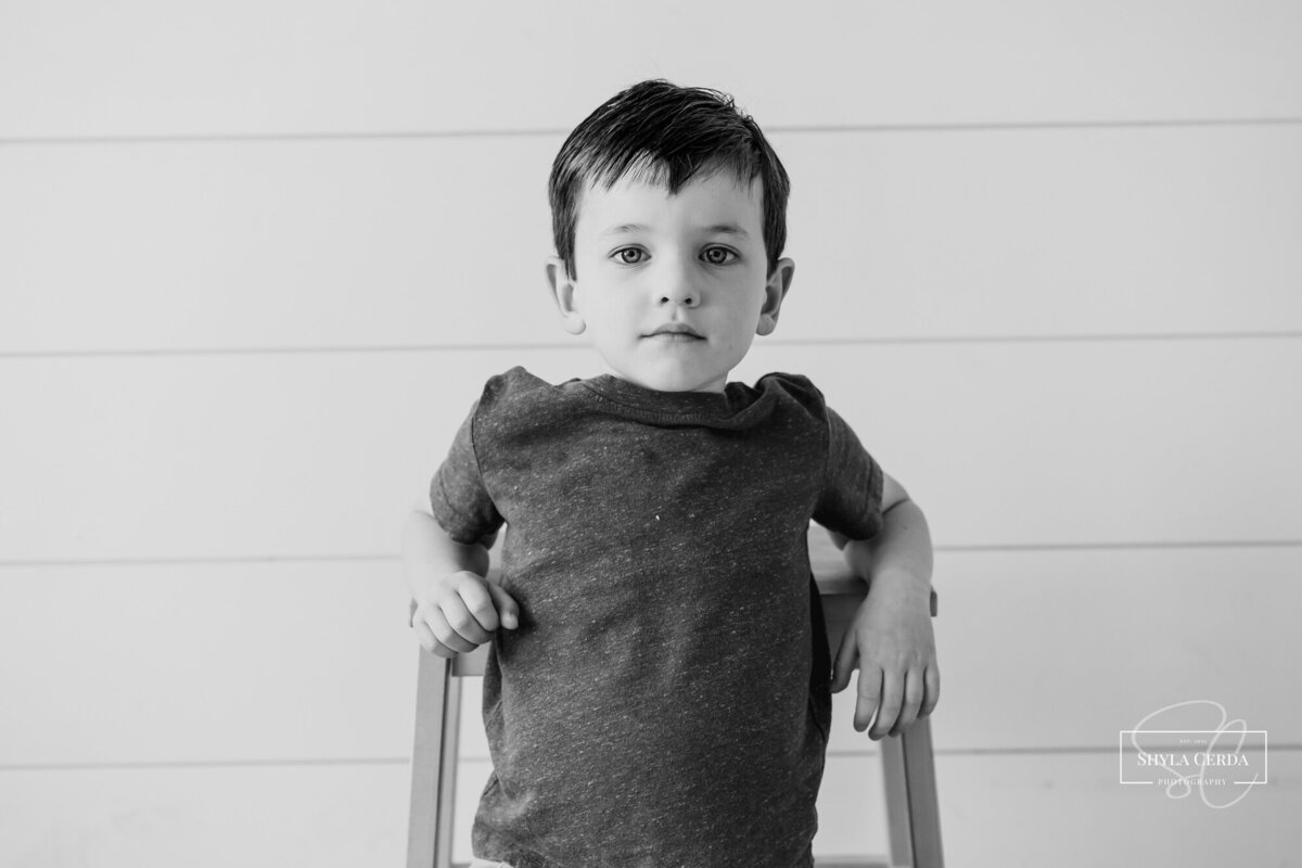 Little boy sitting in studio
