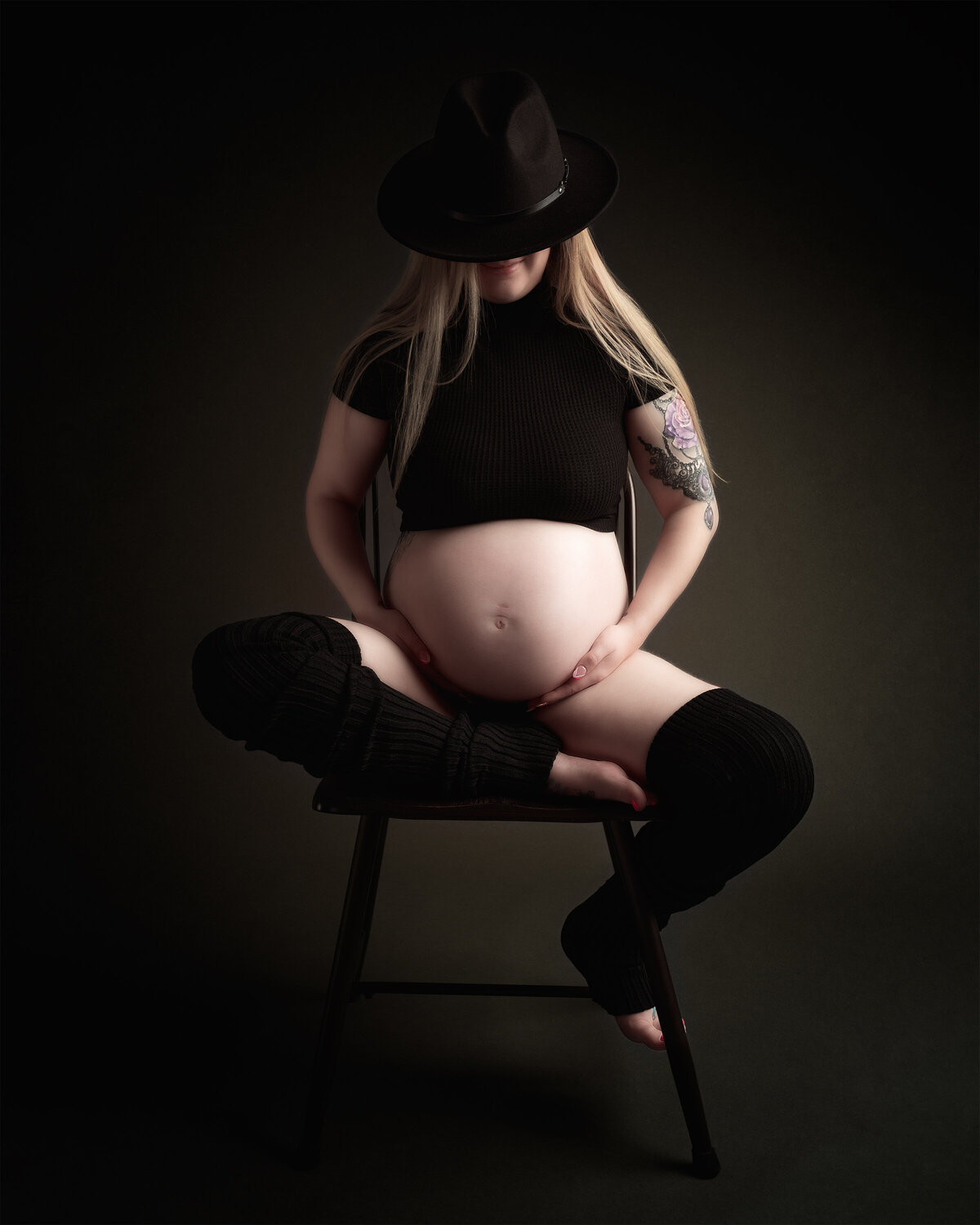 Studio maternity portrait with dark tones and dramatic lighting | Meraki Photographic Creations Paris Ontario