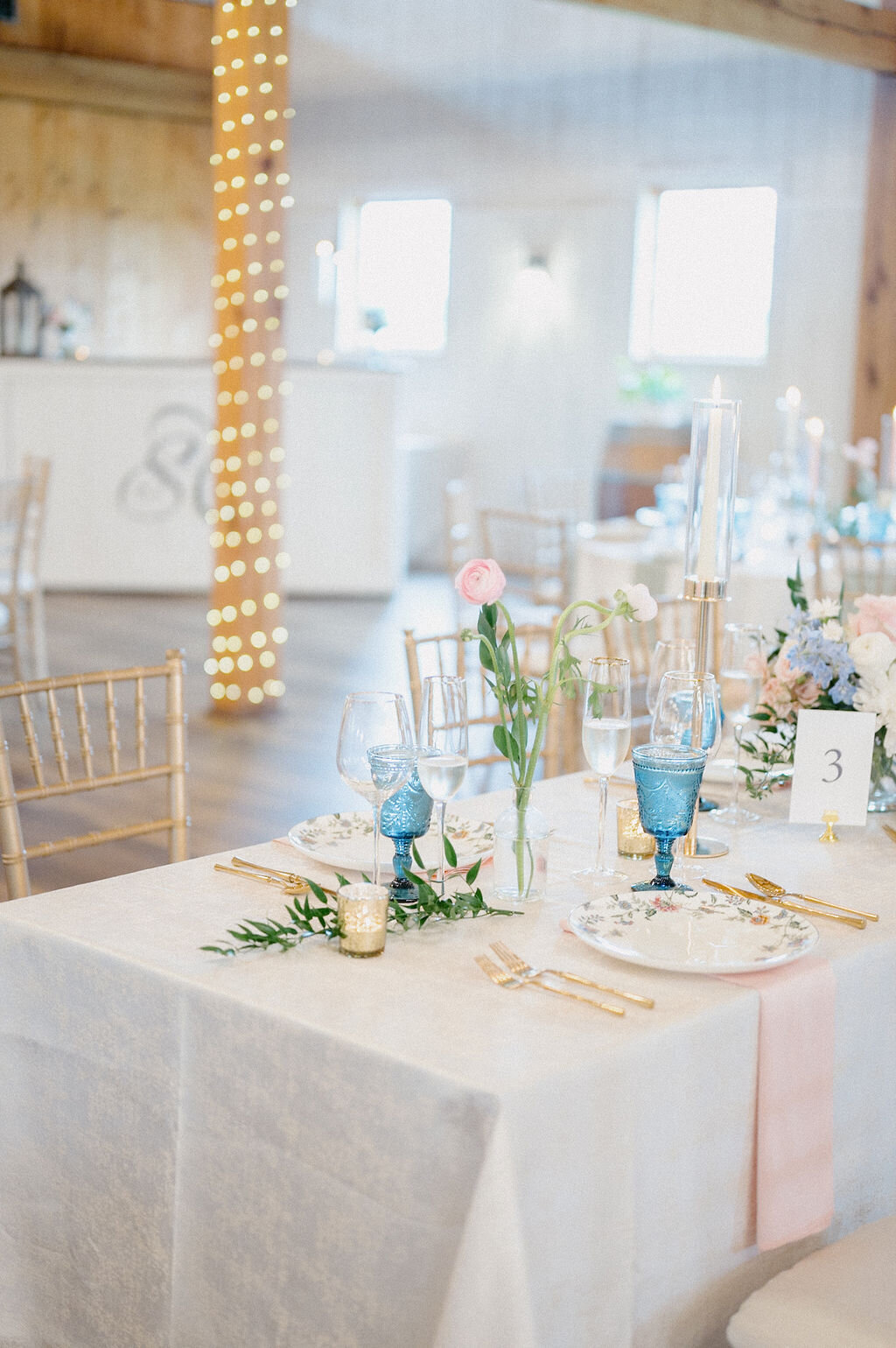 Elegant dining table with white plate and gold utensils