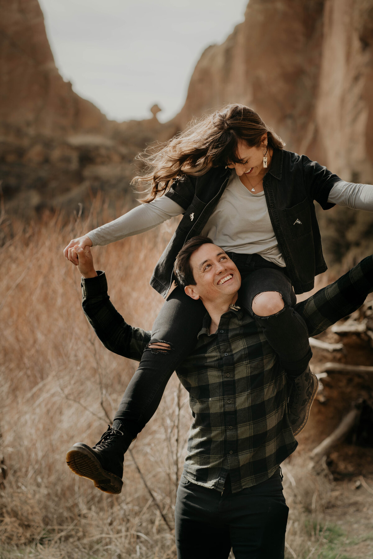 Girl on guy's shoulders during Smith Rock Engagement Session